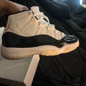 Jordan 11 Retro in Black, White, and Gold